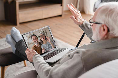 A happy recipient thanking his family via videocall.