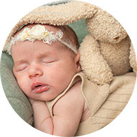 Gender-neutral baby gifts and newborn hampers in soft colors
